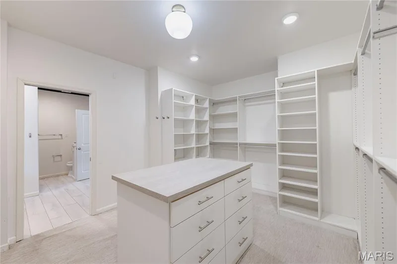 custom walk in primary closet — 11 Orchard Trace Lane, Wildwood, MO 63040