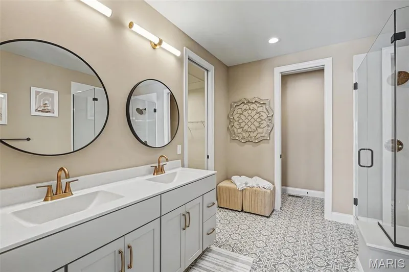 Dual vanity with brass-finish fixtures and stone-finish countertop — 312 Summer Glen Lane, St Charles, MO 63301