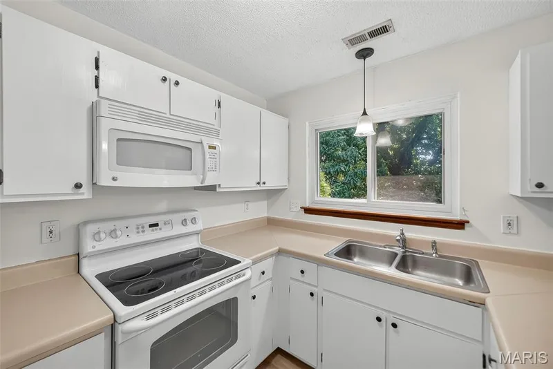 Smooth Top Electric Range and Above the Range Microwave — 1044 Sugar Creek Court #5, St Peters, MO 63376