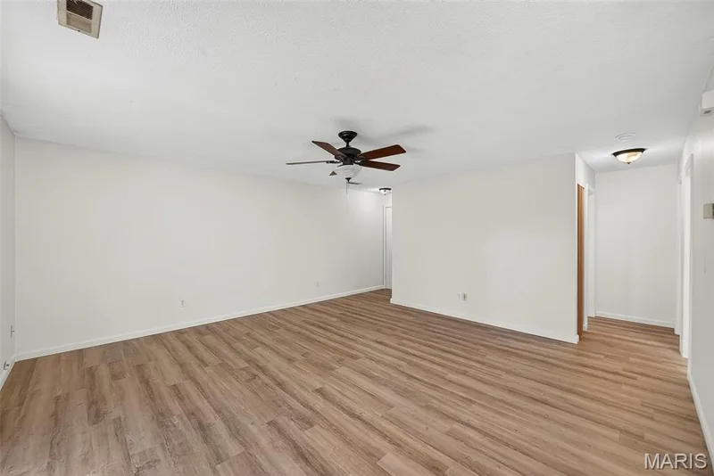 Great Room with Luxury Vinyl Plank Flooring — 1044 Sugar Creek Court #5, St Peters, MO 63376