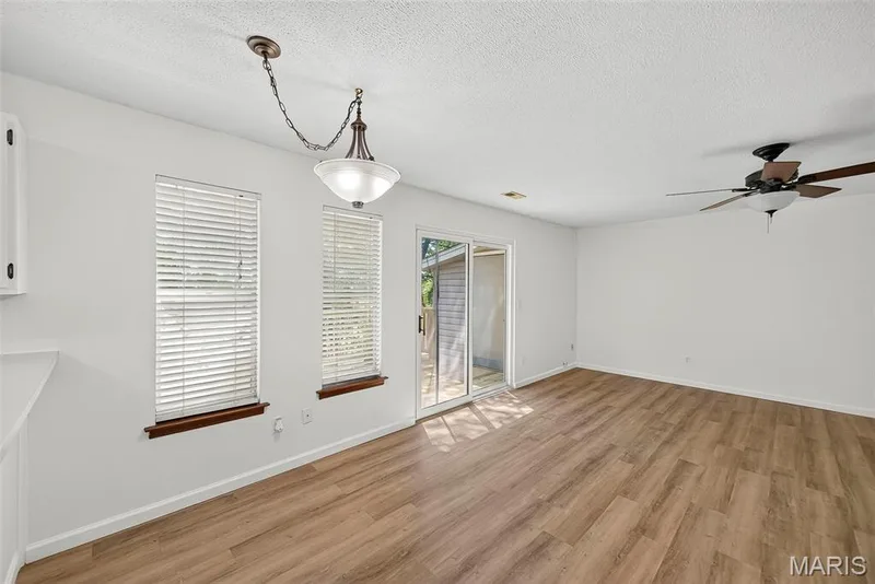 Breakfast Room and Great Room with Sliding Glass Door opening to Deck — 1044 Sugar Creek Court #5, St Peters, MO 63376