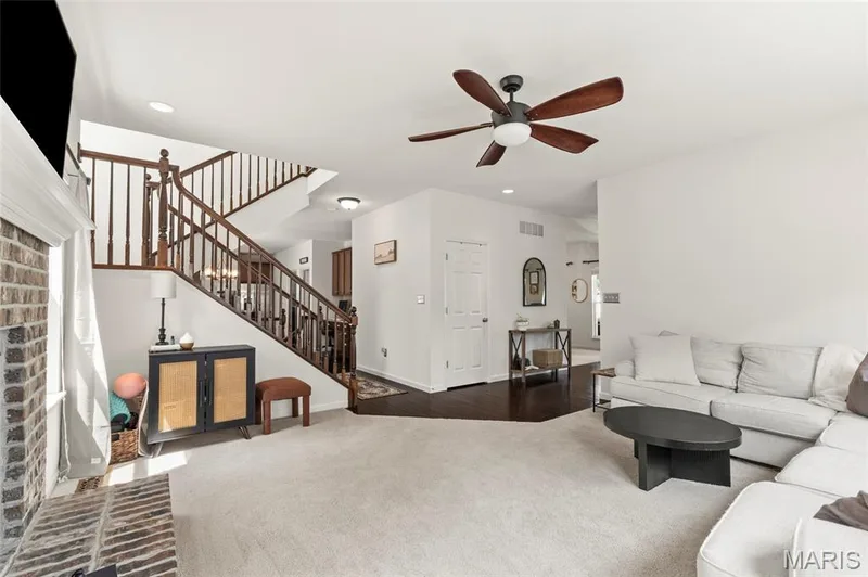 Staircase carpeted to the upstairs or basement. — 921 Molloy Drive, O'Fallon, MO 63366