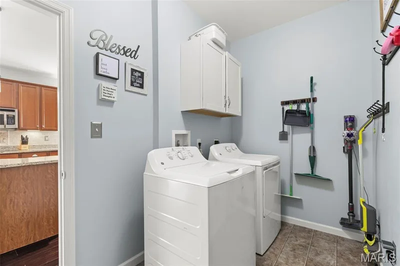 Laundry room between kitchen and 3 car garage. — 921 Molloy Drive, O'Fallon, MO 63366