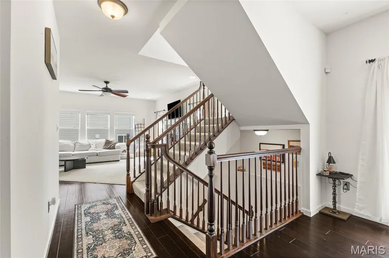 Staircase carpeted to the upstairs or basement. — 921 Molloy Drive, O'Fallon, MO 63366