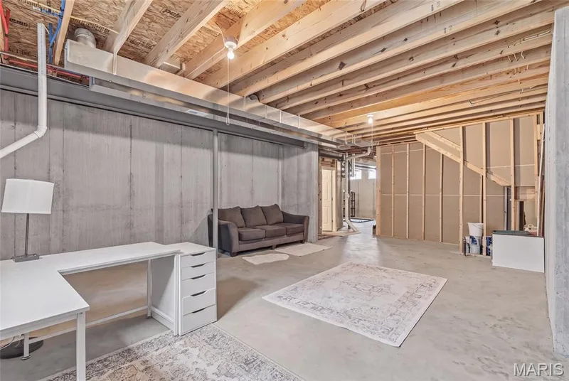 This area features an egress window, ready for that 5th bedroom! Unfinished other than full bath, and ready for your styling desires! — 921 Molloy Drive, O'Fallon, MO 63366