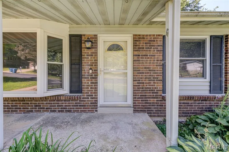 Covered front porch and a decorative brick veneer welcomes you into the home. — 3357 Glendale Avenue, St Charles, MO 63301