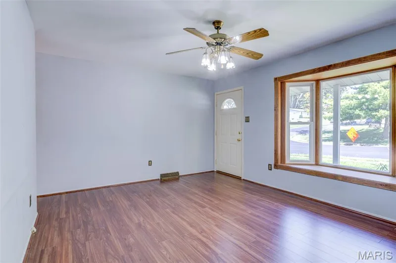 Front living room with a bay window and engineered hardwood flooring. — 3357 Glendale Avenue, St Charles, MO 63301