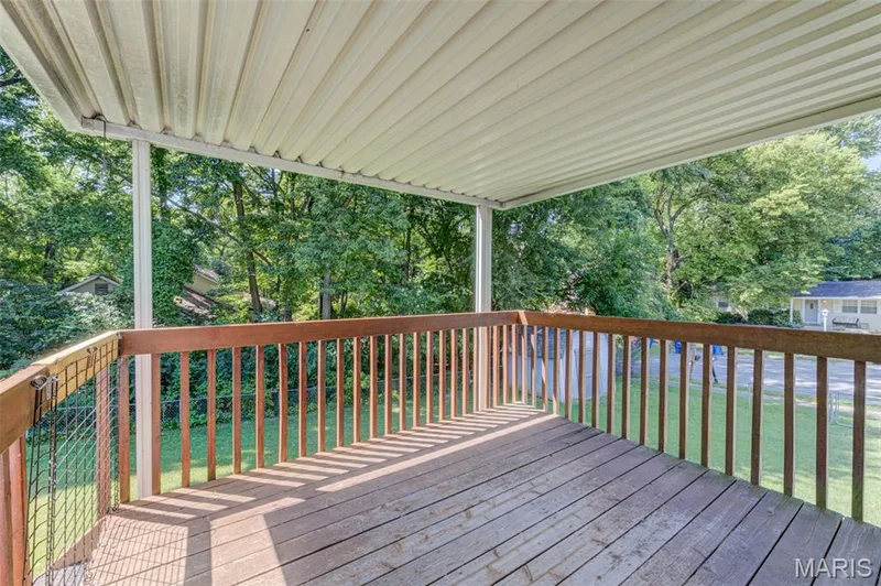 Covered deck overlooks the fenced rear yard. — 3357 Glendale Avenue, St Charles, MO 63301