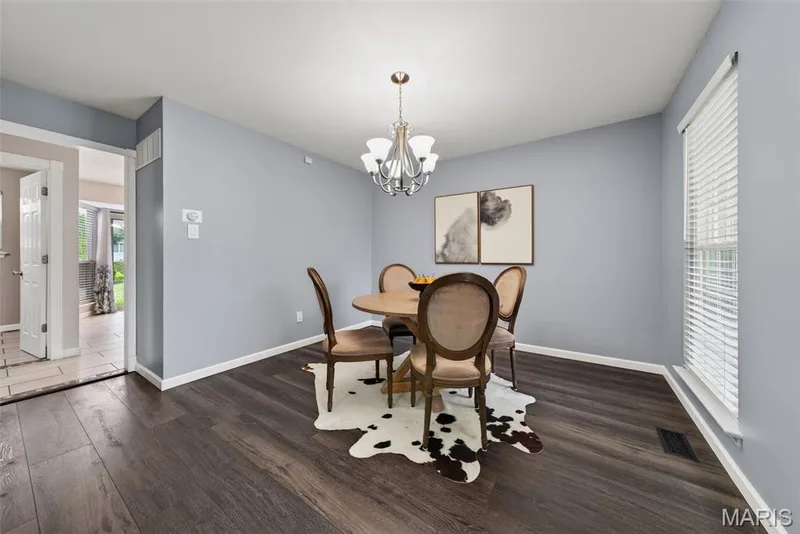 Dining area conveniently leads into the breakfast area and kitchen. — 1016 Lafayette Place, Lake St. Louis, MO 63367