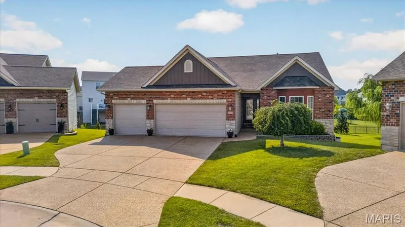 Brick and stone exterior with architectural shingles — 713 Bellingrath Gardens Court, Wentzville, MO 63385