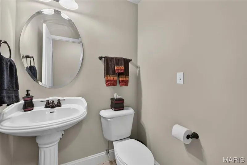 Lower Level Half-Bath, lower level offers additional full bath with shower — 713 Bellingrath Gardens Court, Wentzville, MO 63385