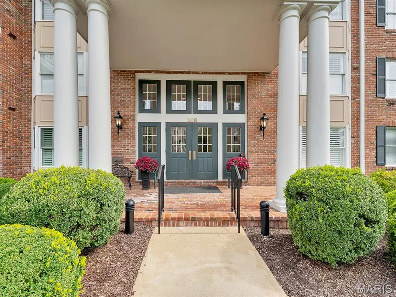 Step inside through a tasteful secured lobby, and proceed to the elevator, or just scurry up the stairs. — 208 Ambridge Court #206, Chesterfield, MO 63017