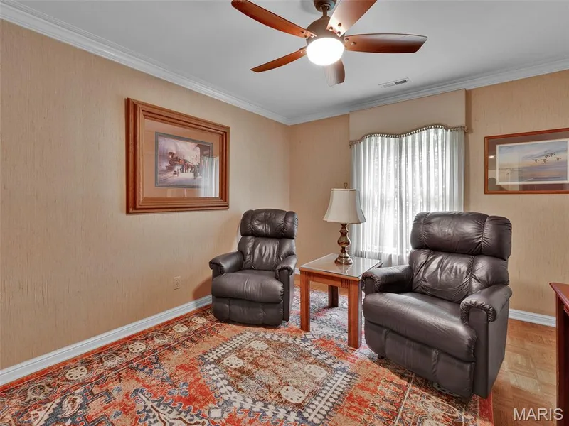 This den or office is technically a third bedroom but functions beautifully as a den with built in cabinetry. — 208 Ambridge Court #206, Chesterfield, MO 63017