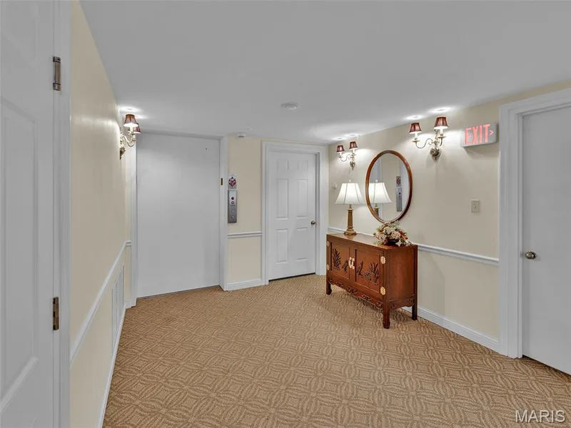 The 2nd floor view of the elevator to the left in this photo, and the door on the right of the elevator is to dedicated storage units for the floor. — 208 Ambridge Court #206, Chesterfield, MO 63017