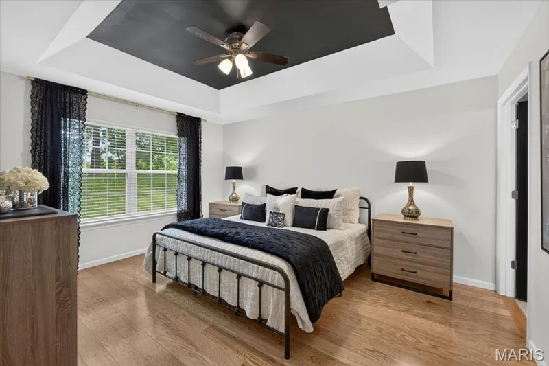 Recessed tray ceiling with a dark accent panel and ceiling fan — 5 Monarch Trace Court #108, Chesterfield, MO 63017