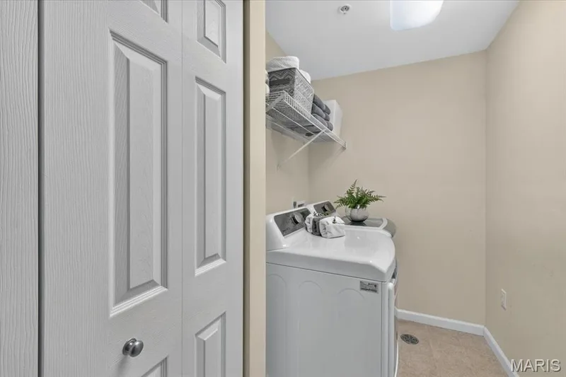 Dedicated laundry area featuring a full-size washer and dryer — 5 Monarch Trace Court #108, Chesterfield, MO 63017