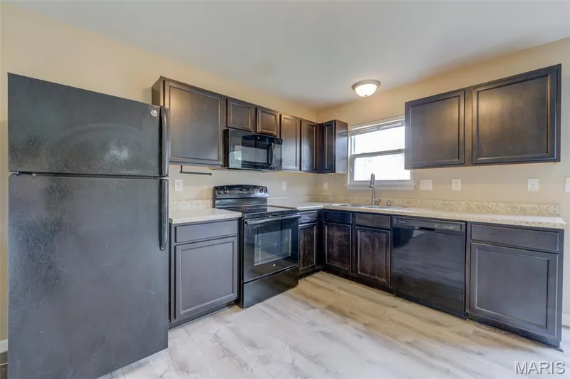 Lots of dark espresso colored cabinets — 1844 Sterling Oaks Drive, St Peters, MO 63376