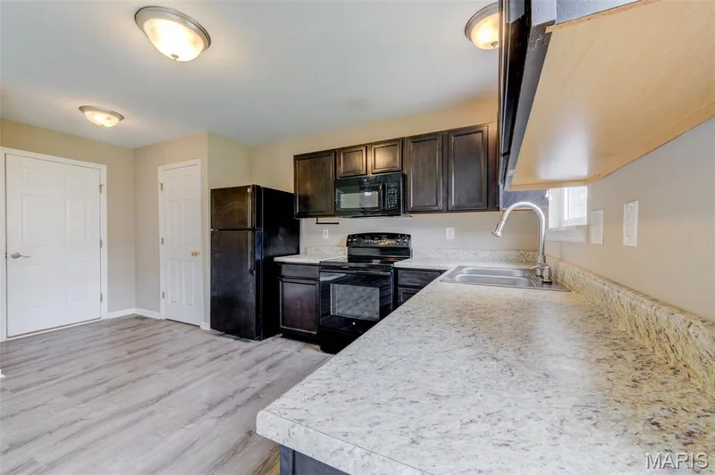 Lots of counter and cabinet space plus a pantry — 1844 Sterling Oaks Drive, St Peters, MO 63376
