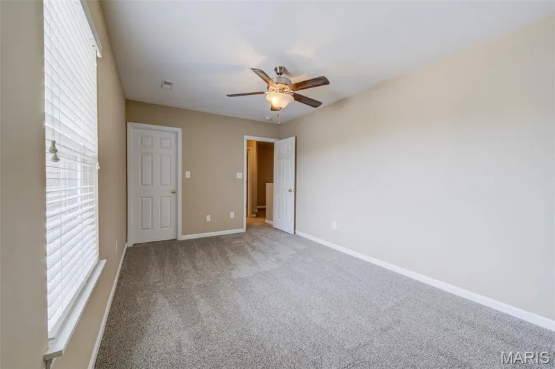 The secondary bedroom has a ceiling fan as well — 1844 Sterling Oaks Drive, St Peters, MO 63376