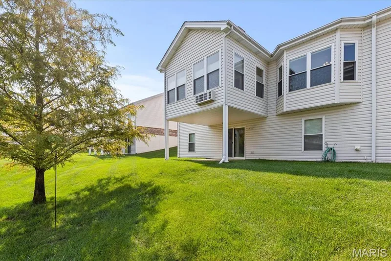 Outdoor view of Four season room and walk out to Patio — 253 Strayhorn Drive, St Peters, MO 63376