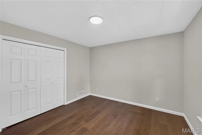 Main floor bedroom number two with updated luxury flooring. — 33 Timber Ridge Drive, Marthasville, MO 63357