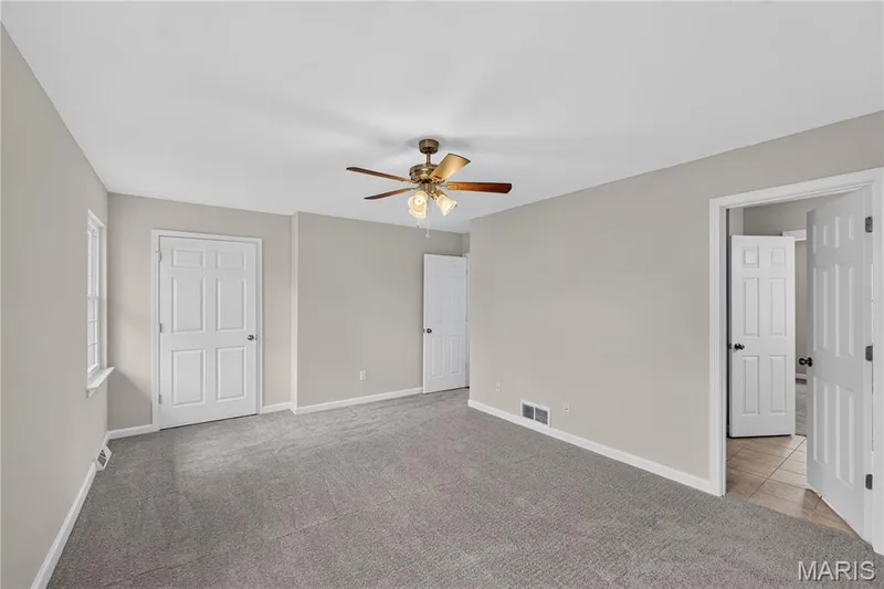 Neutral wall tones, gray carpeting, and white trim — 33 Timber Ridge Drive, Marthasville, MO 63357