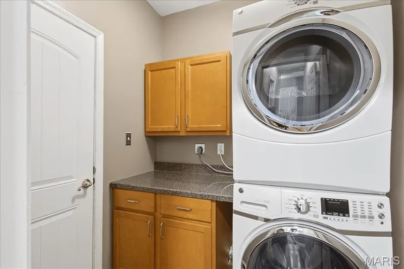 Laundry room with cabinets.  Door to garage. — 175 Beacon Point Lane, Wildwood, MO 63040