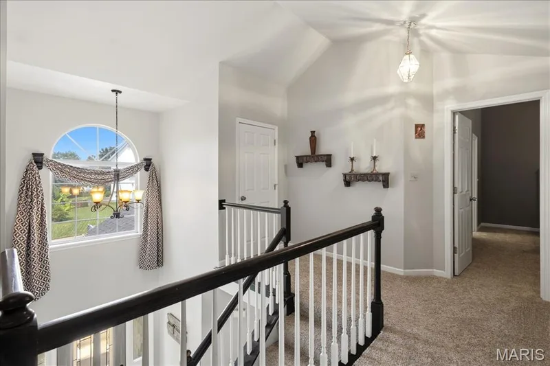 Stairs lead to all the second floor bedrooms. including the primary bedroom, 3 additional bedrooms and 2 full bathrooms. — 175 Beacon Point Lane, Wildwood, MO 63040