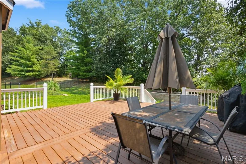Large deck (22x19) overlooks the backyard. — 175 Beacon Point Lane, Wildwood, MO 63040