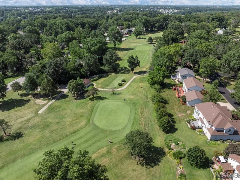 Aerial perspective showcasing properties bordering a golf course — 4 Chantilly Court, Lake St. Louis, MO 63367