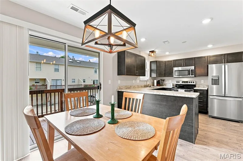 Gorgeous open kitchen and dining space with access to the deck. — 40 Trailside Court #2, St Peters, MO 63303
