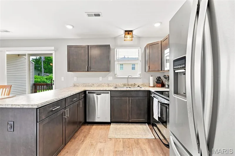 Updated Kitchen with Stainless Steel Appliances including the refrigerator. — 40 Trailside Court #2, St Peters, MO 63303