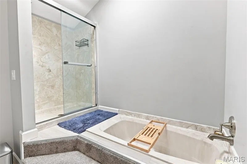 Luxurious En Suite with a Walk-In Closet, Oversize long vanity, sunken tub and separate shower. — 40 Trailside Court #2, St Peters, MO 63303