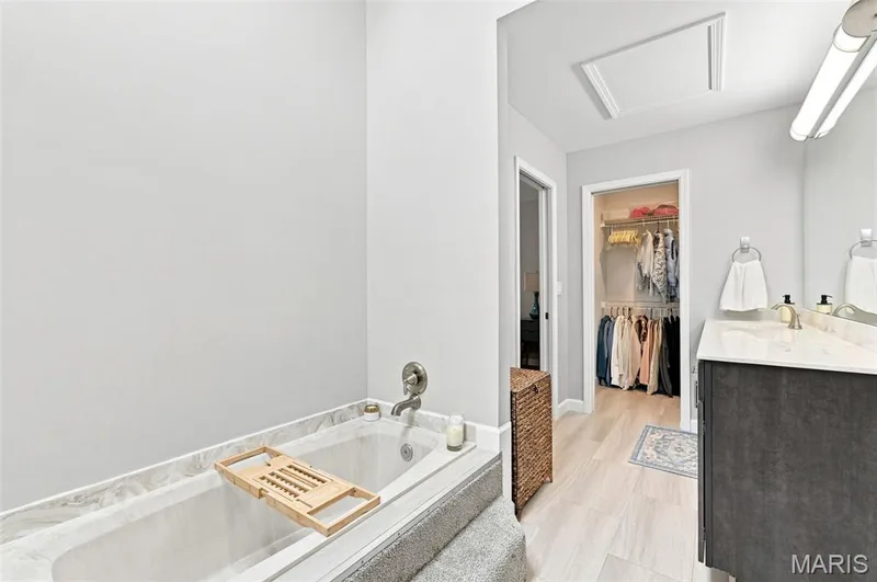 Luxurious En Suite with a Walk-In Closet, Oversize long vanity, sunken tub and separate shower. — 40 Trailside Court #2, St Peters, MO 63303