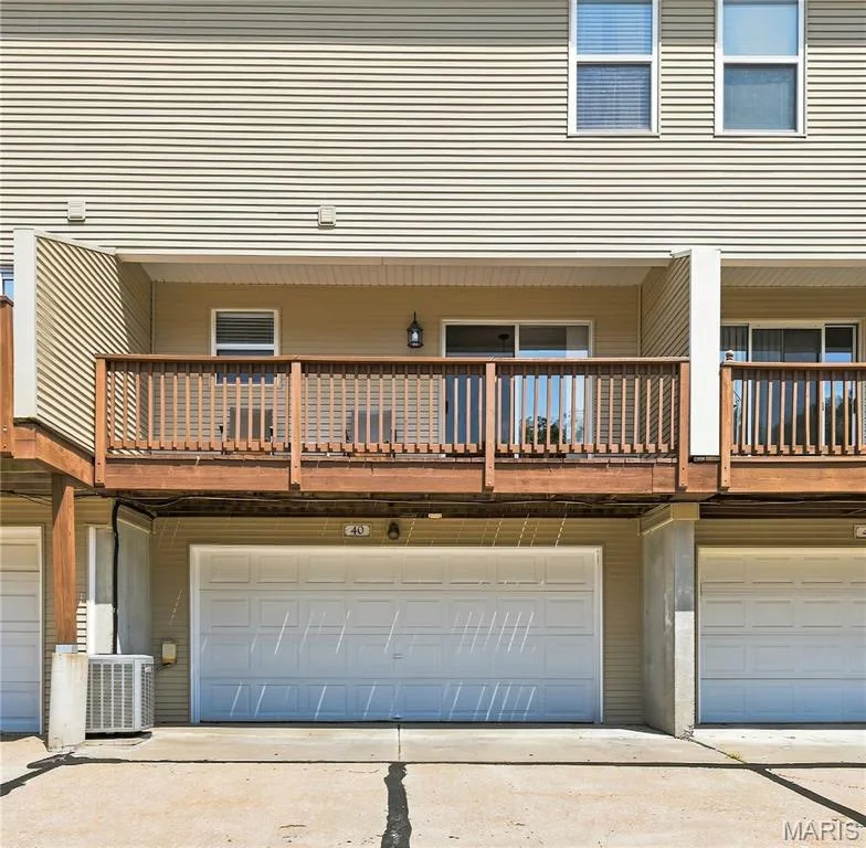 2-Car Attached Garage - 27 feet deep - can be storage or more living space in the lower level.  Think rec room for ping pong or a new art studio! — 40 Trailside Court #2, St Peters, MO 63303