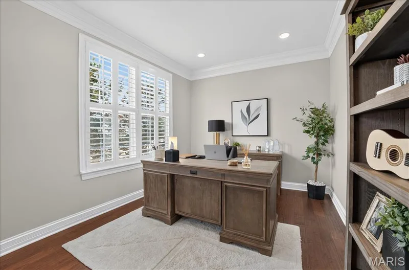 Dedicated room featuring a large window with white plantation shutters, crown molding, and recessed lighting — 302 Oak Stand Court, Chesterfield, MO 63005
