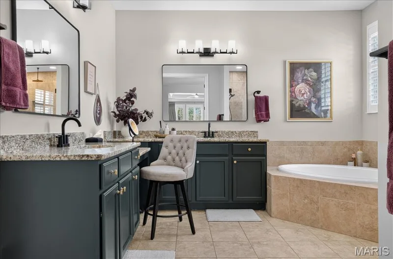 Dual vanity with granite countertops, undermount sinks, and matte black fixtures — 302 Oak Stand Court, Chesterfield, MO 63005