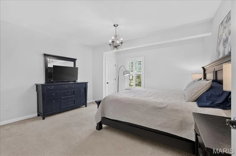 Plush carpeted flooring complements the light wall tones — 302 Oak Stand Court, Chesterfield, MO 63005