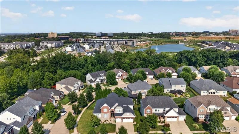 Residential community featuring diverse architectural styles and mature landscaping — 302 Oak Stand Court, Chesterfield, MO 63005