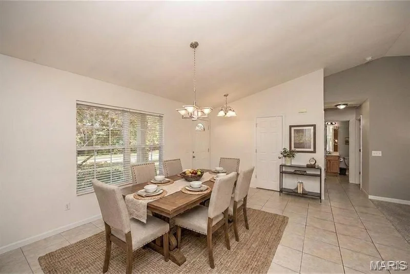 AI Enhanced to show space as a formal dining room. — 3808 Bedford Pointe Drive, Wentzville, MO 63385