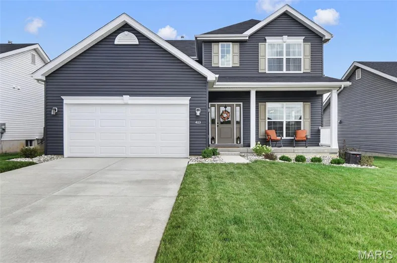 Front exterior view. Enjoy downtime sitting out on this front porch! — 403 Yellow Rose Court, Wentzville, MO 63385
