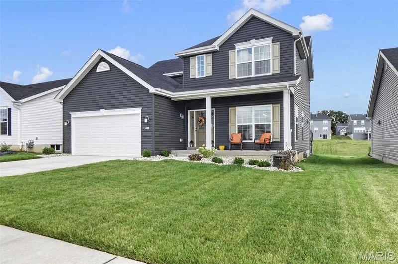 Front exterior view. Enjoy downtime sitting out on this front porch! — 403 Yellow Rose Court, Wentzville, MO 63385