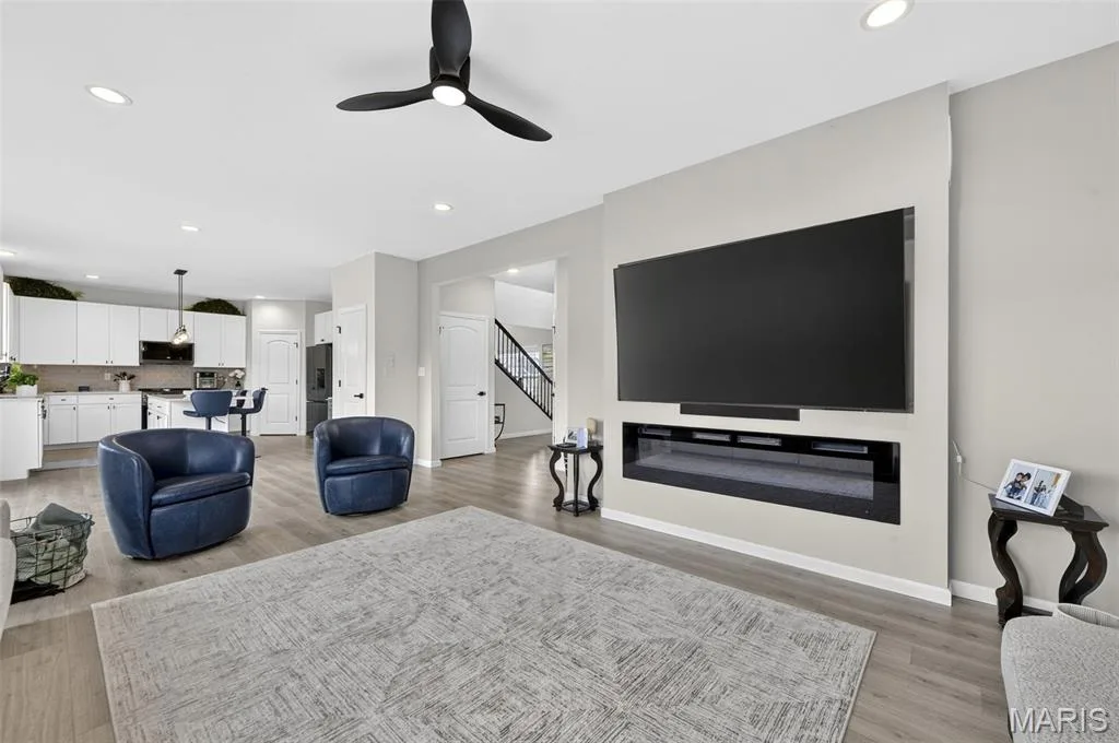 For those nights of entertainment or relaxation, enjoy this large space to unwind. Make it even cozier when utilizing the built-in electric fireplace! — 403 Yellow Rose Court, Wentzville, MO 63385