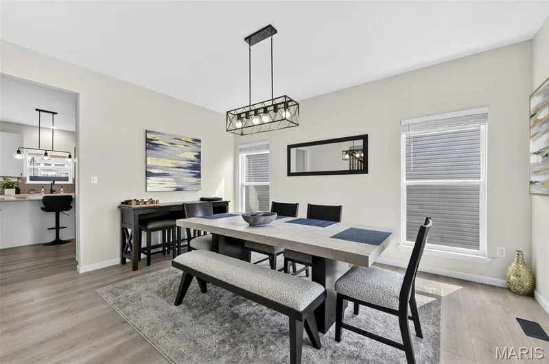 For a more formal occasion, entertain your guests in the dining room for a fancy dinner or plan for a fun game night! — 403 Yellow Rose Court, Wentzville, MO 63385