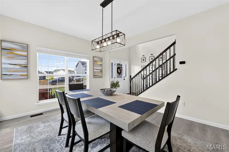 For a more formal occasion, entertain your guests in the dining room for a fancy dinner or plan for a fun game night! — 403 Yellow Rose Court, Wentzville, MO 63385