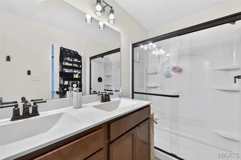Enjoy your space with the double vanity sinks in the primary bathroom! — 403 Yellow Rose Court, Wentzville, MO 63385