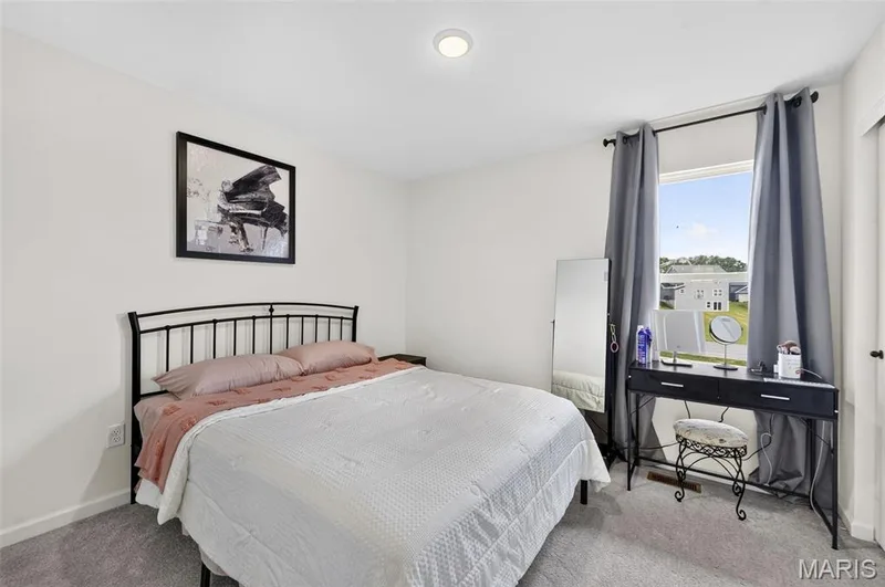 Bedroom 3 located on the upper floor and a view overlooking the backyard. — 403 Yellow Rose Court, Wentzville, MO 63385