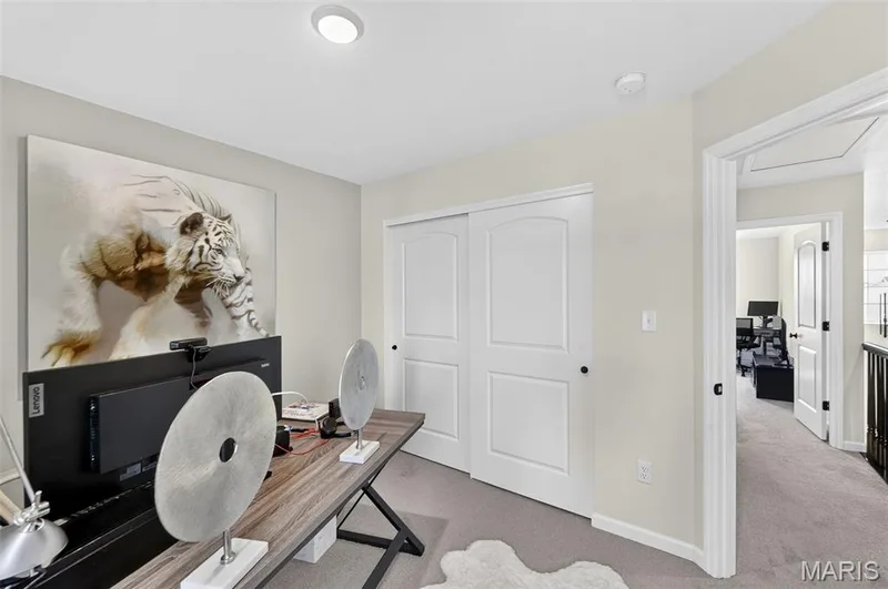 Bedroom 4, currently utilized as a home office, located on the upper floor and a view overlooking the backyard. — 403 Yellow Rose Court, Wentzville, MO 63385