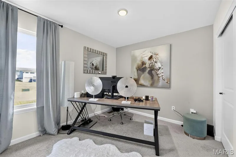 Bedroom 4, currently utilized as a home office, located on the upper floor and a view overlooking the backyard. — 403 Yellow Rose Court, Wentzville, MO 63385