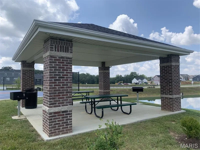 Pavilion with BBQ pits and tables for community use and enjoyment. Conveniently located next to the sports court on Aspen Daisy Ct. — 403 Yellow Rose Court, Wentzville, MO 63385